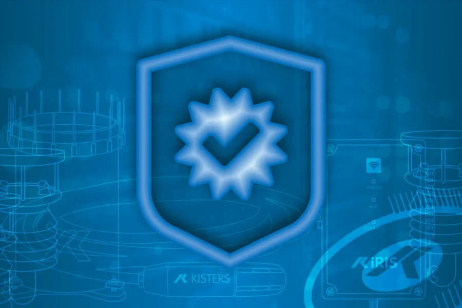 Un graphique numérique bleu représente un bouclier avec une coche à l'intérieur d'un symbole en forme d'étoile, sur un fond de diagrammes techniques et de lignes de faible intensité ressemblant à des circuits.